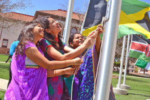 Margaret McKinney/Highlands University Highlands students from India raise their flag at an April 2015 international flag raising ceremony at the university. Highlands celebrates Indian and all cultures during Culture Fest March 28 – April 1. 