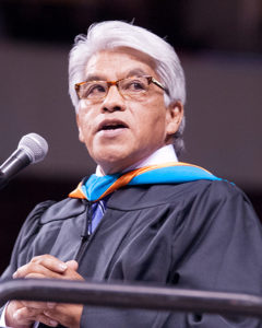 Photo by Richard Loeffredo/NMHU Former Cochiti Pueblo Gov. Regis Pecos addresses the Highlands University – Rio Rancho Class of 2016 May 12 at the Santa Ana Star Center. 