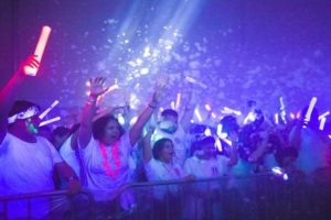 Photo of students having fun with glow sticks