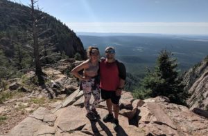 Photo of two hikers at Hermit's peak.