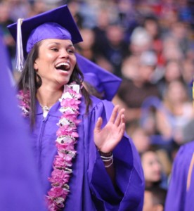 Photo of graduate smiling and applauding