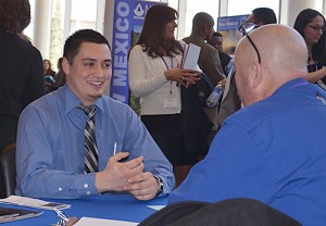 Student sitting at table for an interview with a prospecitve employer