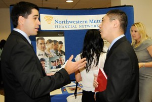 Photo of recruiter and student chatting at career fair