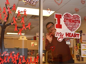 Photo of person putting stickers on window