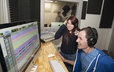 Music students Rock Ullibarri, Janika Jaramillo and Quintin Leger work in the university's recording studios. 