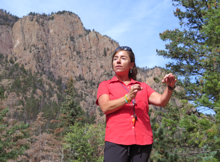 Highlands geology professor Jennifer Lindline interprets the geology of El Cielo Mountain during a hike along El Porvenir Trail west of Las Vegas that she led for the New Mexico Geological Society Fall Field Conference. Photo: Margaret McKinney/Highlands University