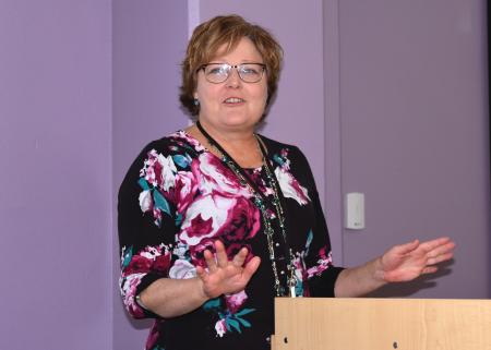 Diana Marrs, director of the new Center for Teaching Excellence at Highlands University, speaks at its open house Nov. 20. The center aims to increase student success at Highlands through ongoing faculty and instructor development. Other speakers at the open house included Sam Minner, Highlands University president, Teresita Aguilar, provost and vice president of academic affairs, Leveo Sánchez, chair of the university’s Board of Regents, and LouElla Marr-Montoya, a member of the Board of Regents. The Center for Teaching Excellence is in the Victoria D. Sanchez Teacher Education Center, Room 102, 1031 11th St. The center was developed in collaboration with the university’s faculty. It serves all academic disciplines on the main campus as well as the university’s statewide centers. A crowd turned out for the open house. Photo by Margaret McKinney/Highlands University
