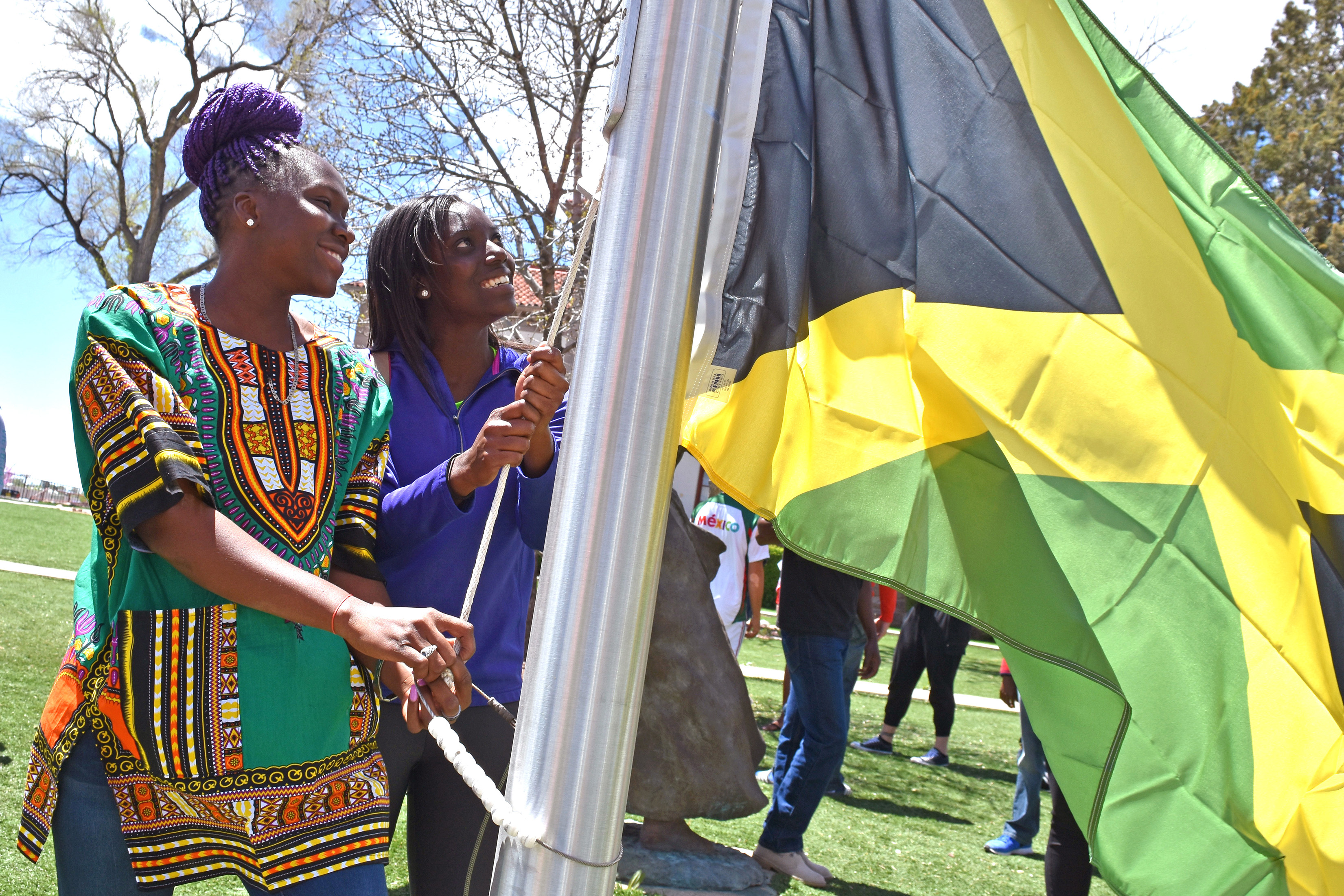 International students raising flag