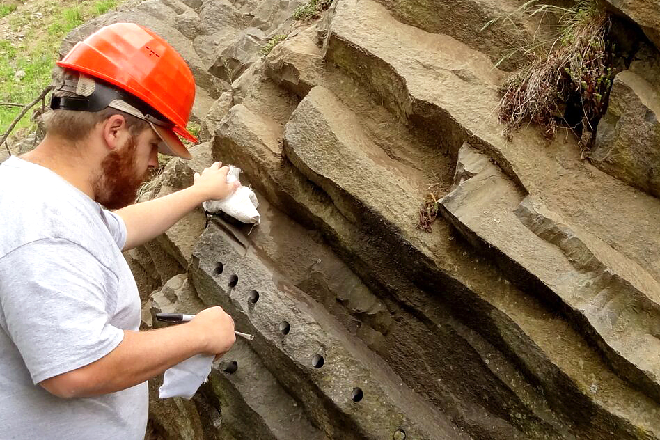 Highlands student extracting rock cores.