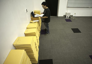 Student sorts sheet music donation