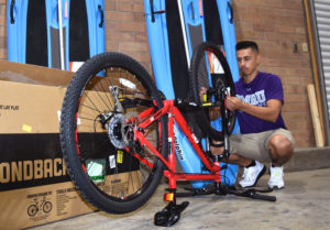 photo of person assembling bike