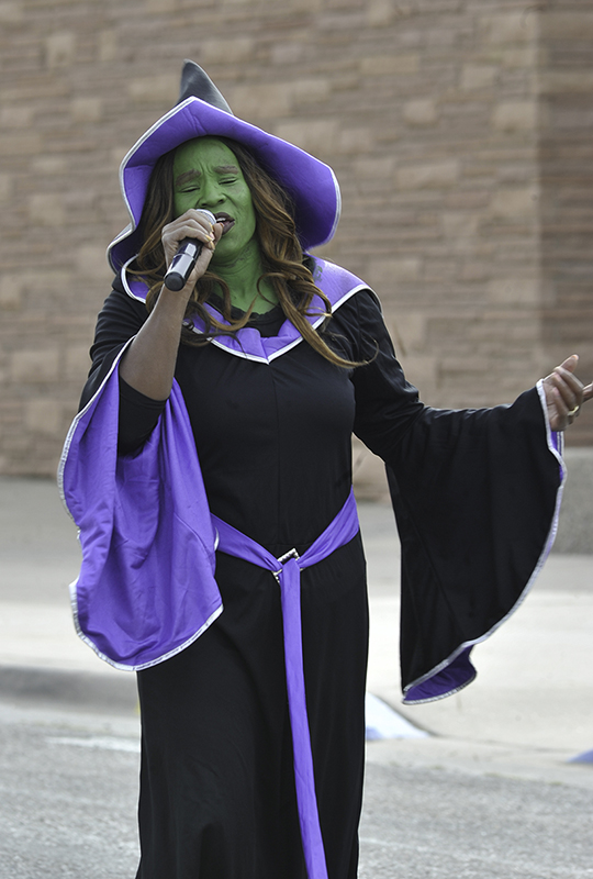 Nita Lujan sings during the 2016 homecoming parade Oct. 8.