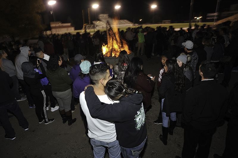 Highlands students enjoy the warmth of a bonfire Oct. 7 in Perkins Stadium.