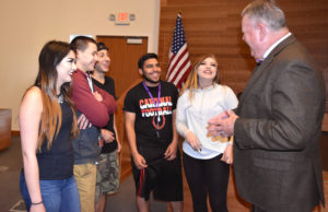 Photo of president with students