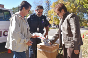 Photo of people puting bags in box