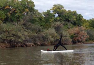 Photo of student doing yoga in water. 