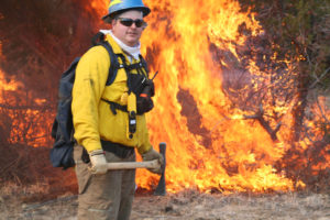 Photo of Brian Henington with wildfire