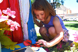 Girl admiring art butterfly