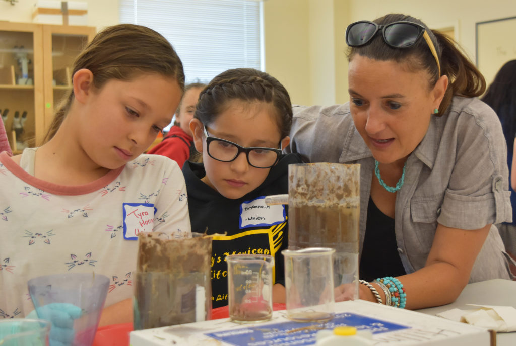 Photo of teacher and two students