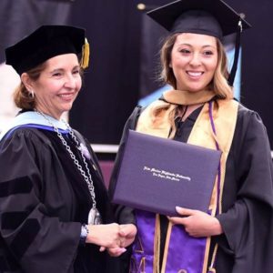 Photo of Provost and student at Rio Rancho graduation