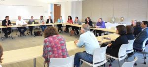 Photo of panel listening to Lt. Governor Howie Morales