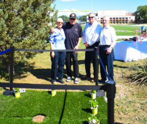 Photo of Ann Gibson, Lionel Taylor, former New Mexico Highlands University football player and former Denver Broncos player; President Minner, with bow tie; and Perry Harper.