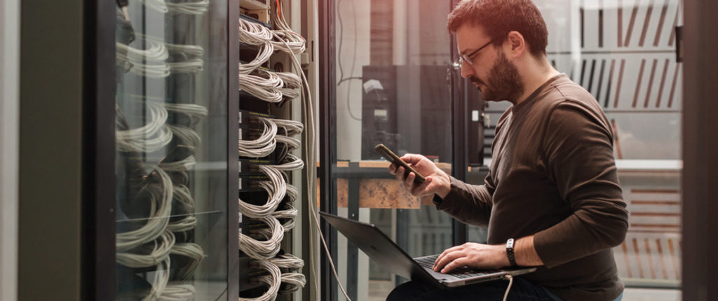 Photo of computer scientist working on panel