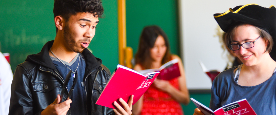 photo of students reading from a script