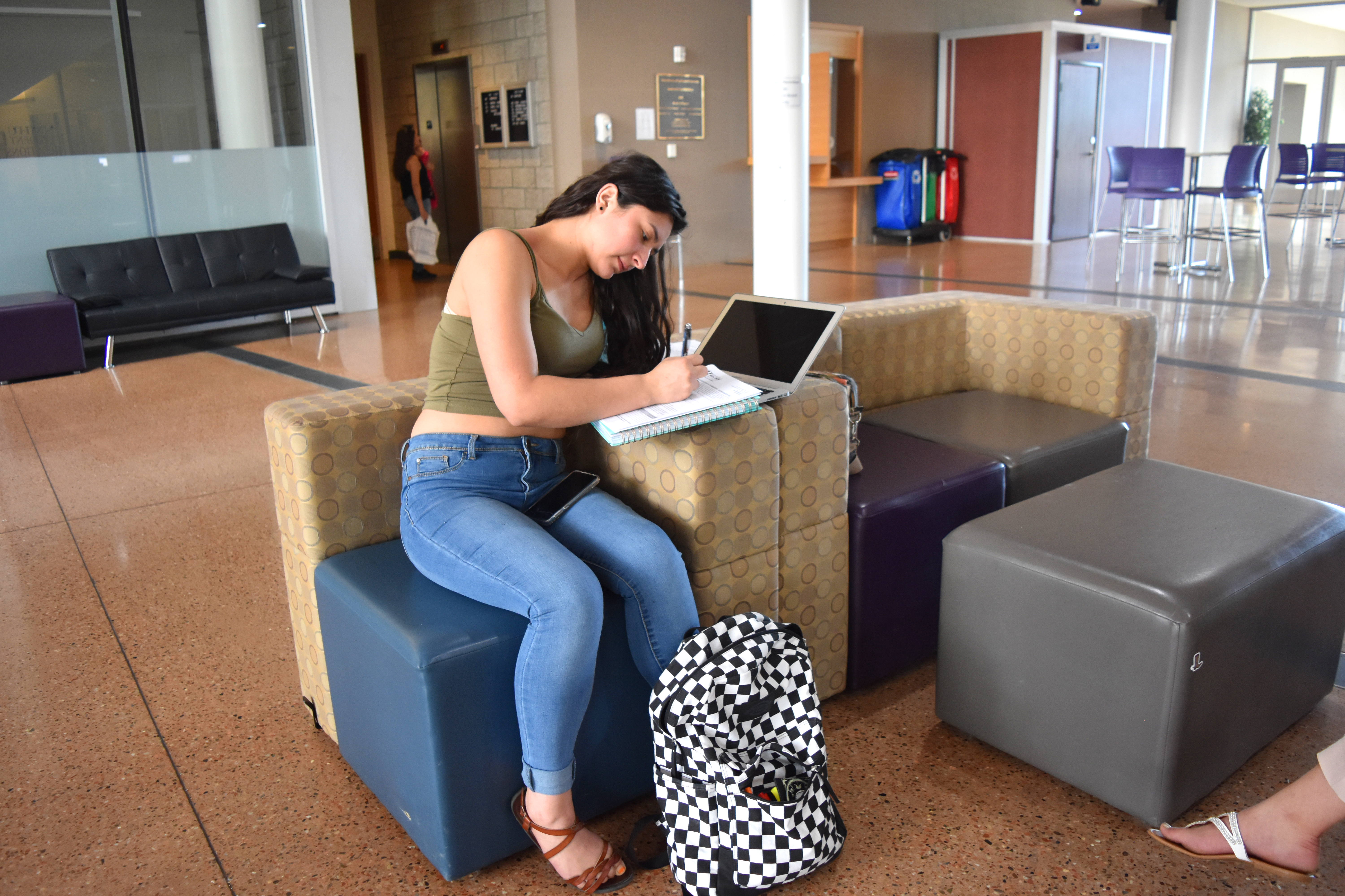 Photo of student working on forms.