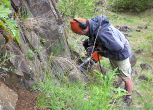 Image of Mike Patronis using drill to collect samples