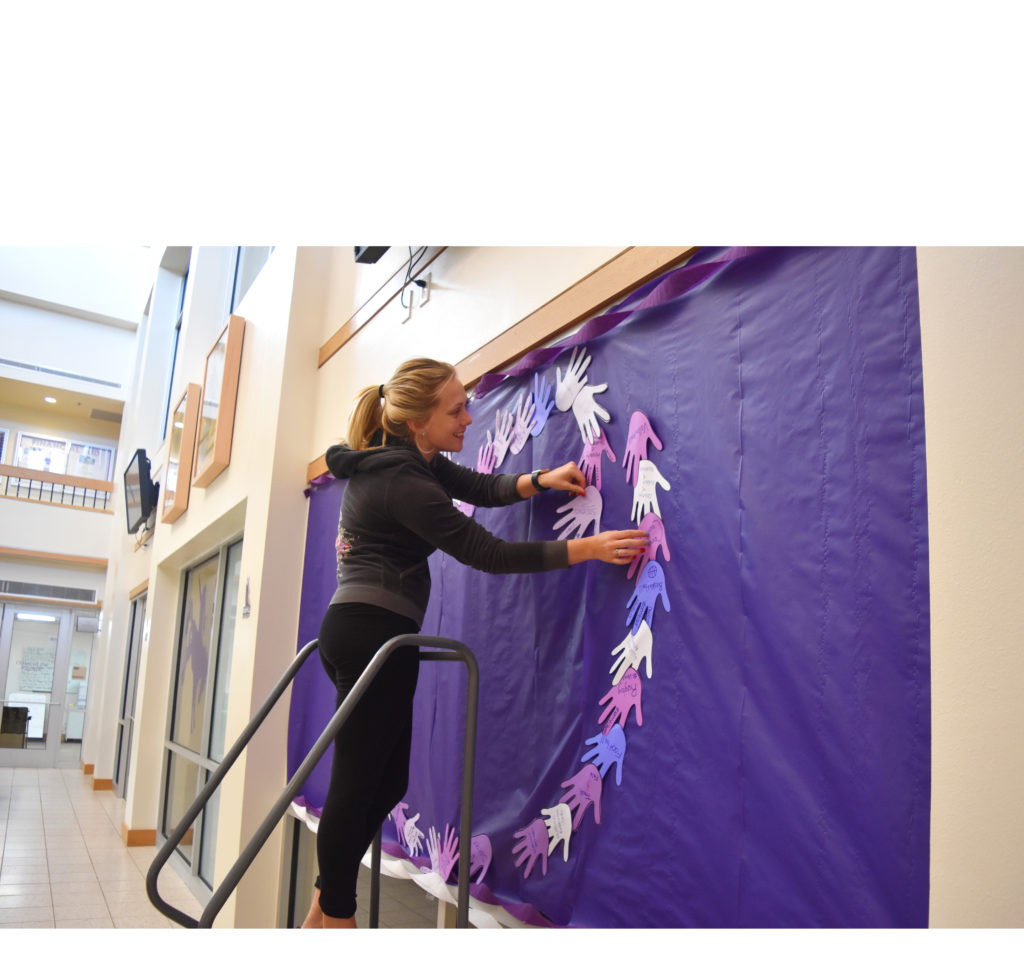 Photo of Kendell Jordan helping to decorate the Student Success Center