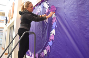 Photo of Kendell Jordan helping to decorate the Student Success Center
