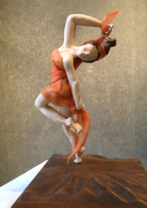 Photo of “Tall Dancer” clay sculpture by Olivia Lovato