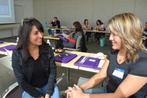 Photo of two counselors chatting.