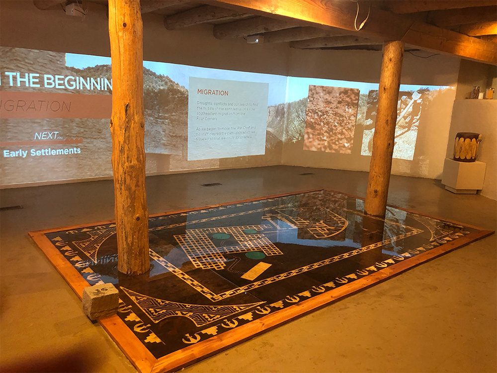 Photo of resin floor and multimedia display at Jemez Historic Site visitors center.