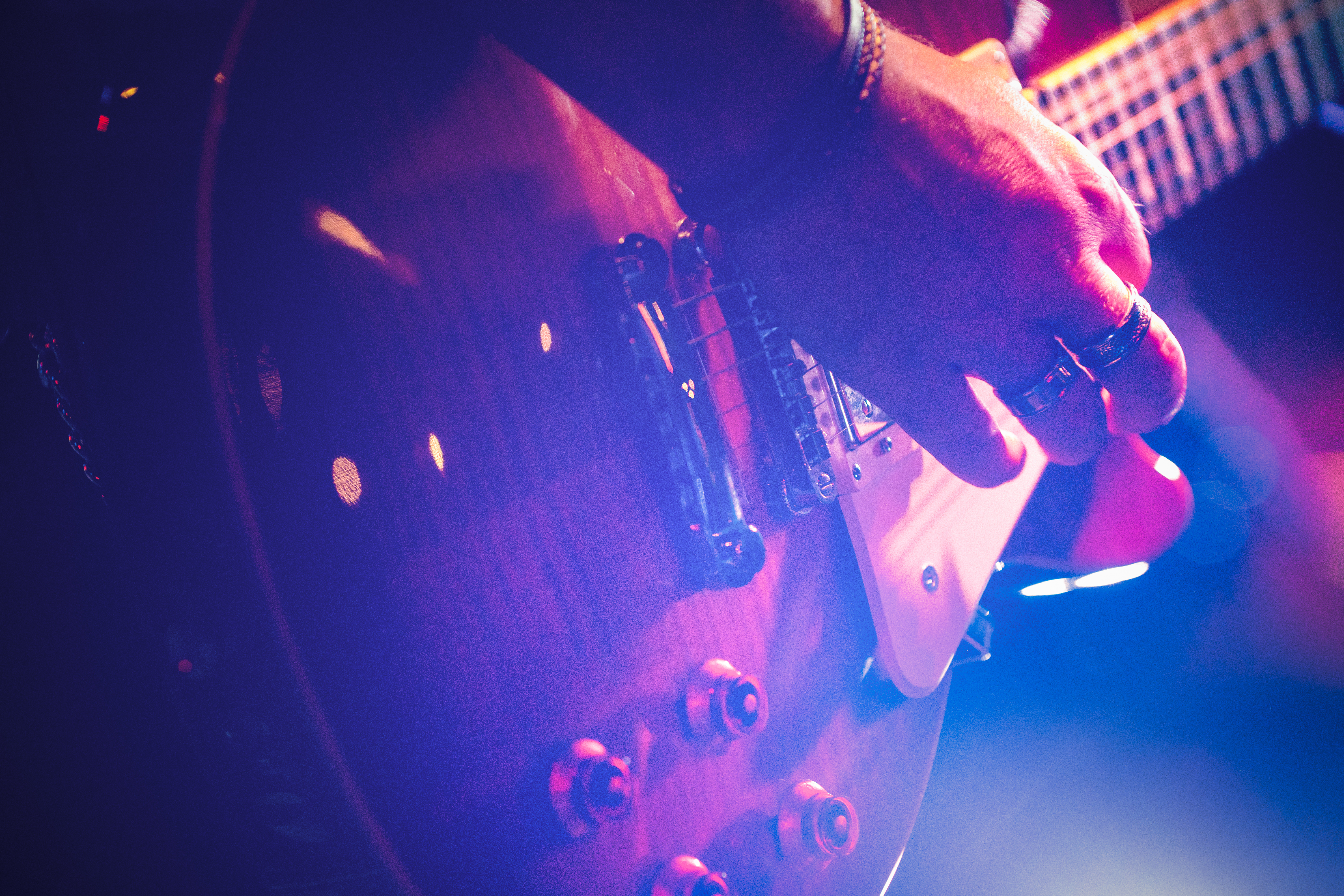 Closeup of hand on guitar strings