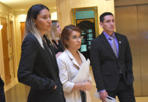 Photo of three students at the Legislature.