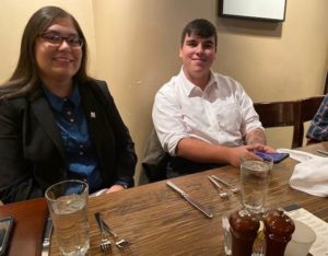 Photo of two students at table.