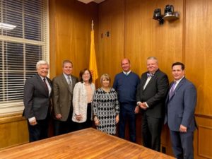 Governor Lujan-Grisham with CUP presidents, standing at a table.