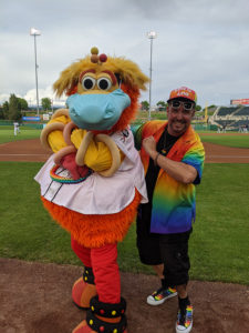 Professor PJ Sedillo poses with the Albuquerque Isotopes mascot