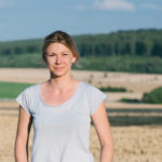 female farmer standing in field