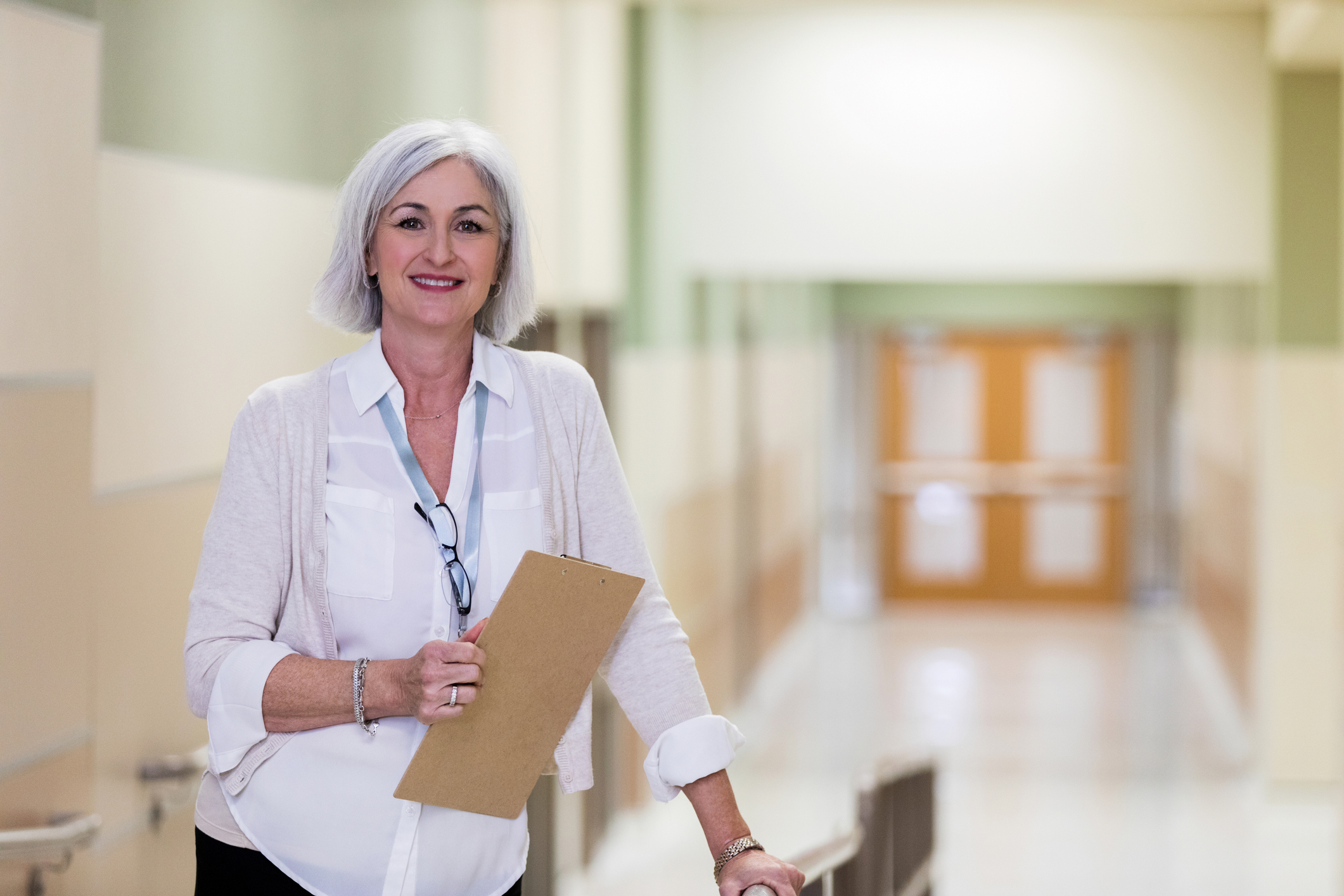 As she goes from her office to the cafeteria, a mature adult counselor takes a break for photo.