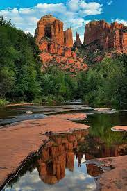 Photo of Oak Creek in Sedona, AZ, with tall rock formations in the background 
