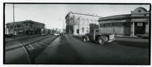 A wide angle black-and-white photograph of the Las Vegas, NM plaza in 1981.