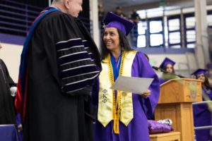 Photo of graduate with Sam Minner