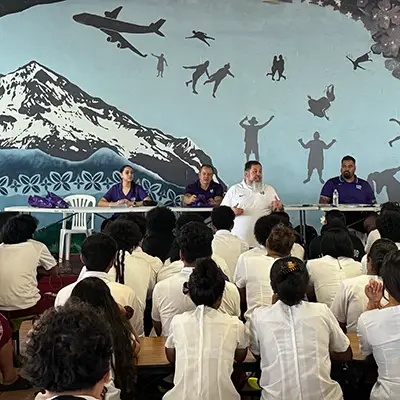 A man is speaking in an auditorium in American Samoa