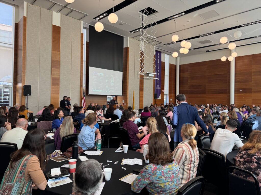 Image of people sitting in a ballroom during Dr. Woolf's speech.
