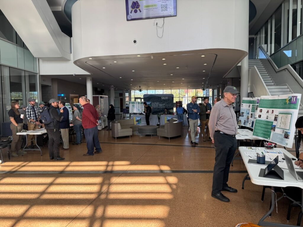 Group of people at the New Mexico Forest and Watershed Restoration Institute open house in the Student Union Building