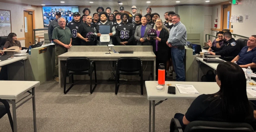 Image of NMHU football team and Coach Kurt Taufa'asa at the Las Vegas City Council meeting on February 11, 2026