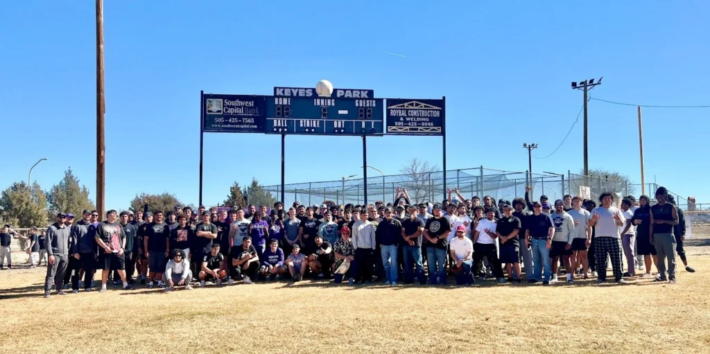 Image of the NMHU Football team and Las Vegas, N.M. city counselors